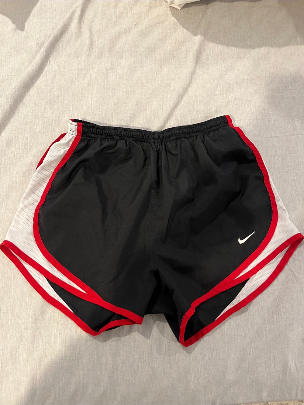 Nike Women’s Black Athletic Shorts with Red Trim and White Panels